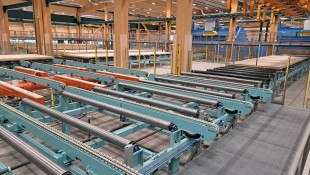 22. Roll and chain conveyors before and after CNC machines, including secondary turning station