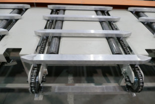 Side sweep chains with ending roller conveyor