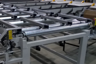 Side sweep chains with ending roller conveyor